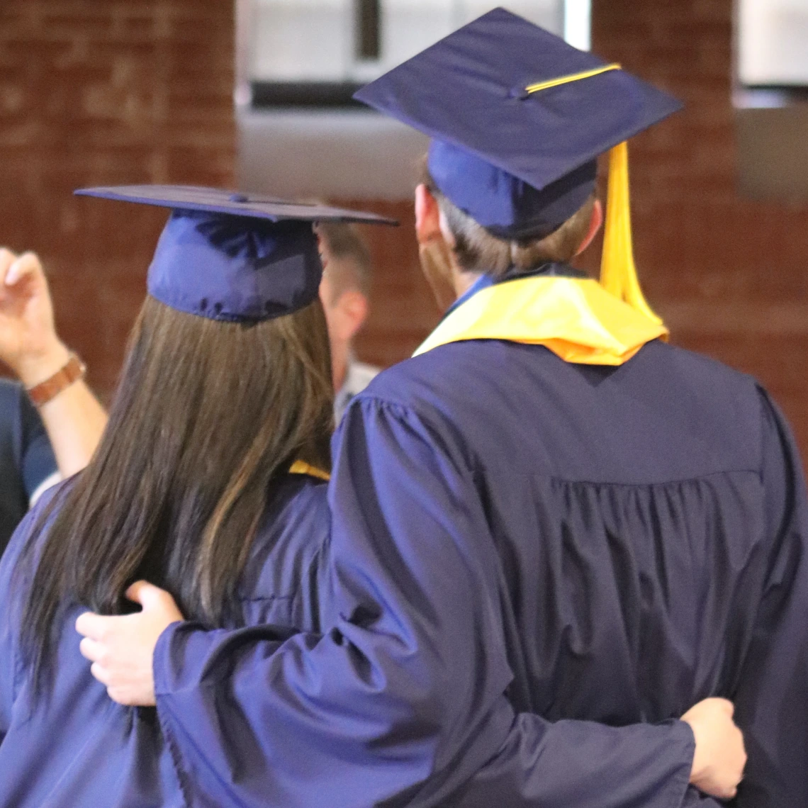 two grads from behind