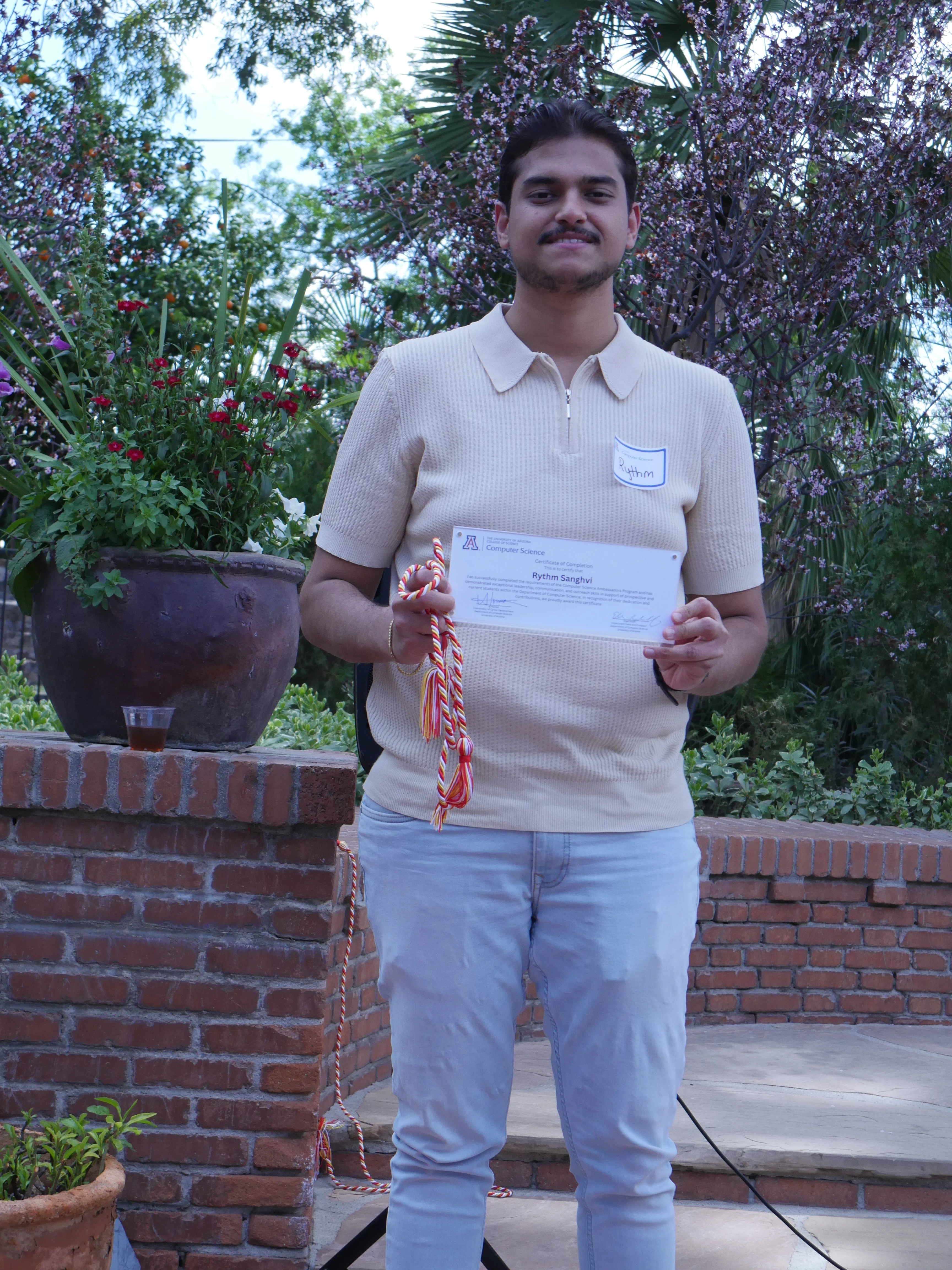 Rhythm displaying his certificate