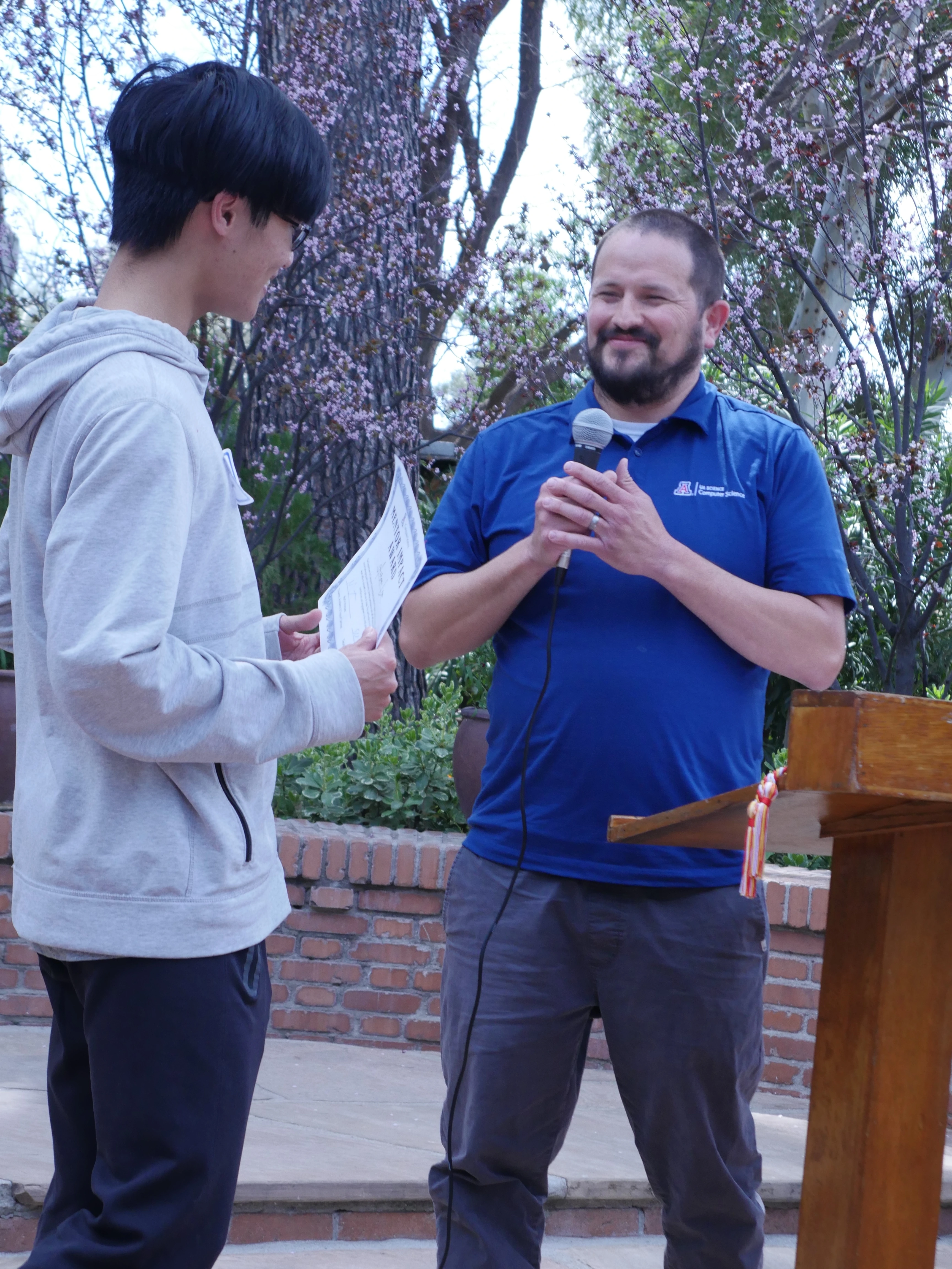 Martin and an awardee at the podium